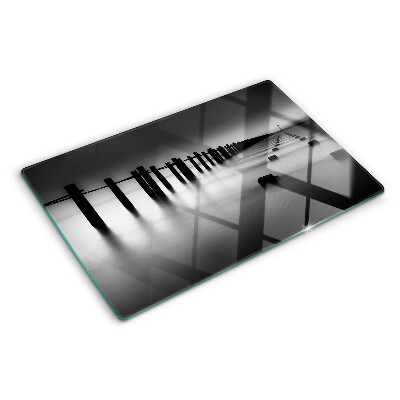 Glass chopping board The pier in black and white