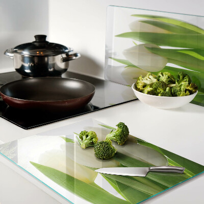 Chopping board Tulips against a background of green leaves