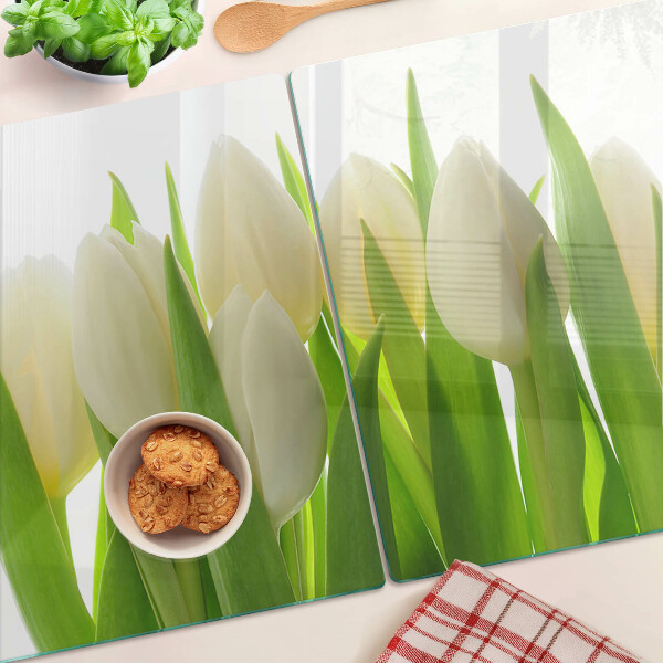 Chopping board Tulips against a background of green leaves