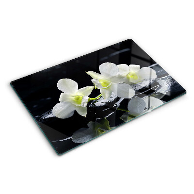 Chopping board glass Orchids on a black background