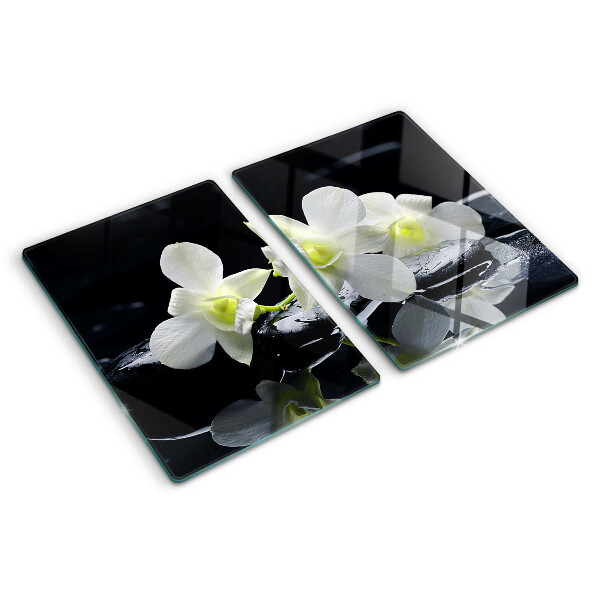 Chopping board glass Orchids on a black background
