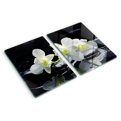 Chopping board glass Orchids on a black background