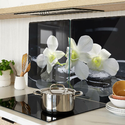 Chopping board glass Orchids on a black background