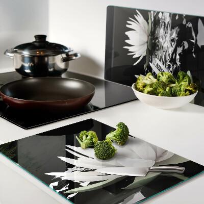 Glass chopping board Water lilies on a black background
