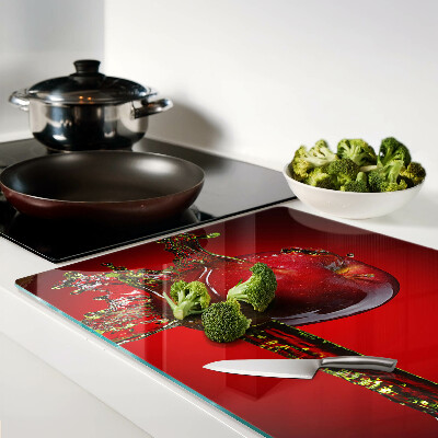 Chopping board glass Red apple with water