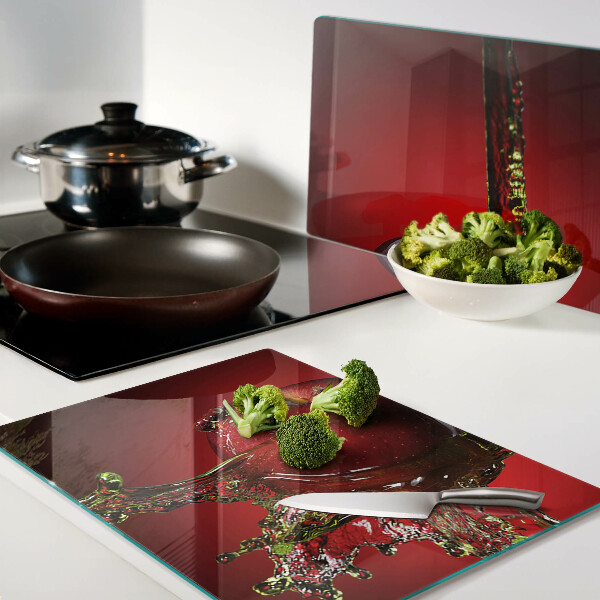 Chopping board glass Red apple with water