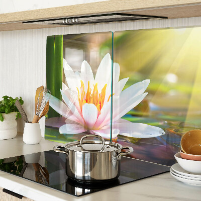 Glass kitchen board Water lily in the sunlight