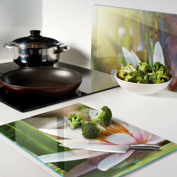 Glass kitchen board Water lily in the sunlight