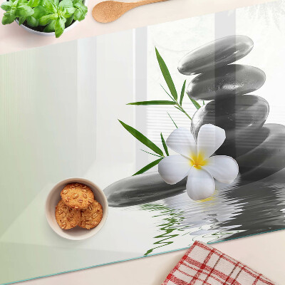 Cutting board Flowers and stones on the water