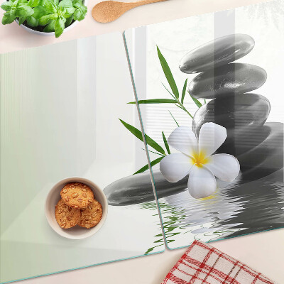 Cutting board Flowers and stones on the water