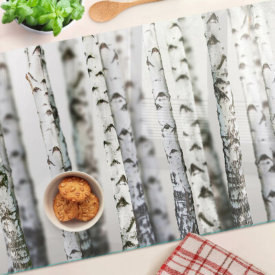 Glass chopping board White birches in the forest
