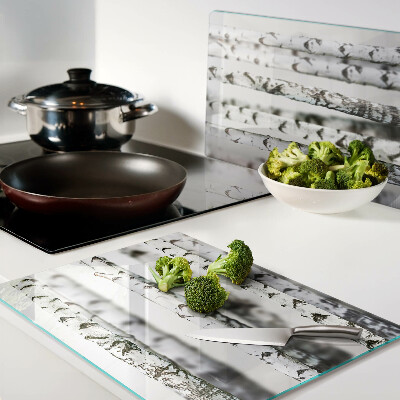 Glass chopping board White birches in the forest