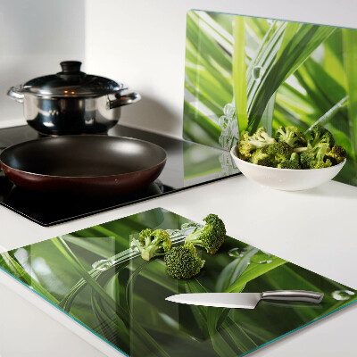 Glass kitchen board Drops of water on the grass