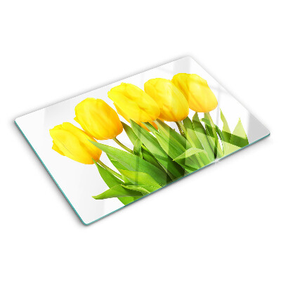 Glass kitchen board Yellow tulips on a green background