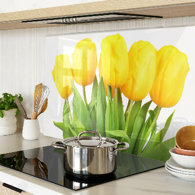 Glass kitchen board Yellow tulips on a green background