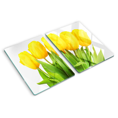 Glass kitchen board Yellow tulips on a green background