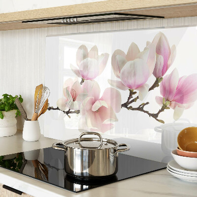 Chopping board glass Magnolia flowers on a branch