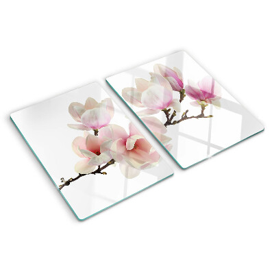 Chopping board glass Magnolia flowers on a branch