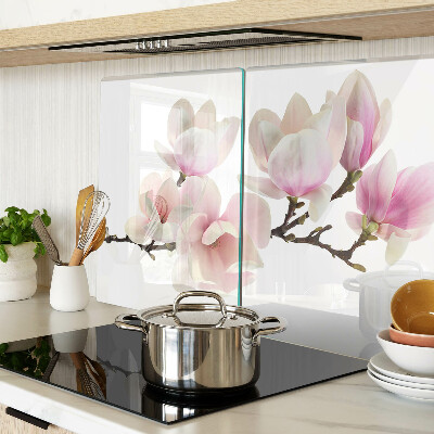 Chopping board glass Magnolia flowers on a branch
