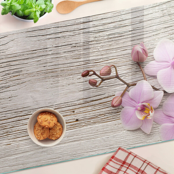 Cutting board Orchids on a wood background