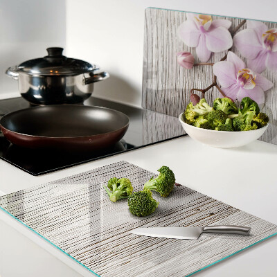 Cutting board Orchids on a wood background