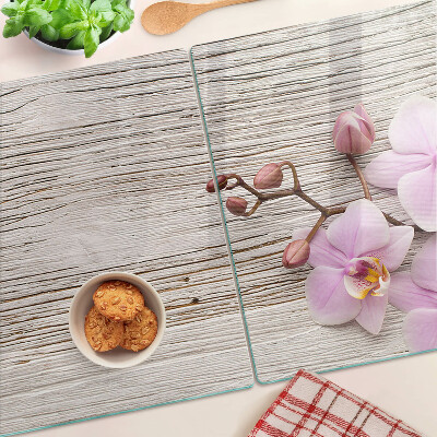 Cutting board Orchids on a wood background