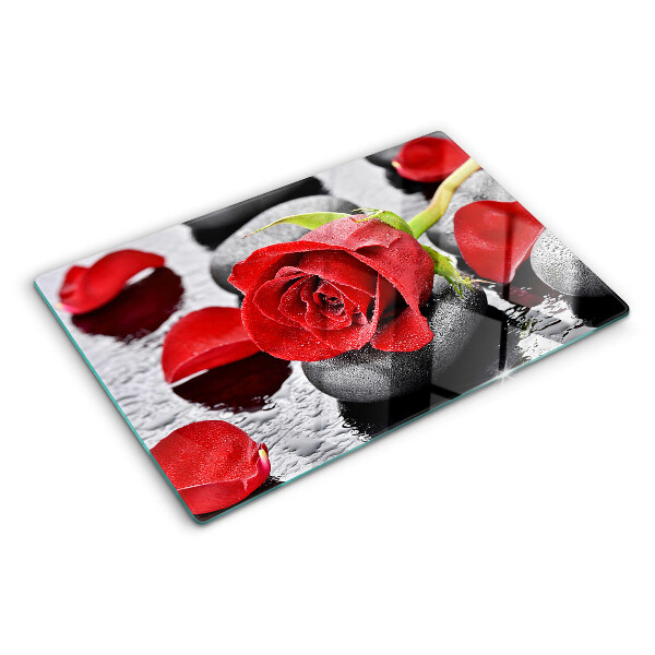 Glass cutting board Rose on stones with water drops