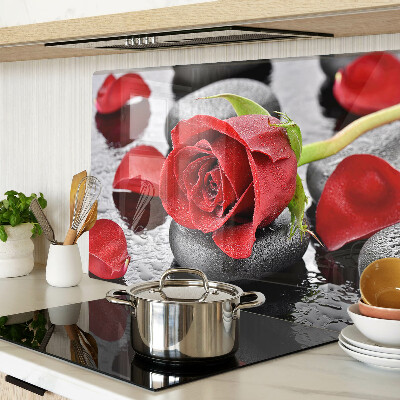 Glass cutting board Rose on stones with water drops