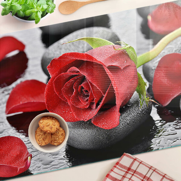 Glass cutting board Rose on stones with water drops