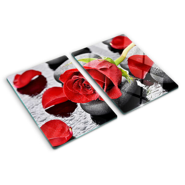 Glass cutting board Rose on stones with water drops