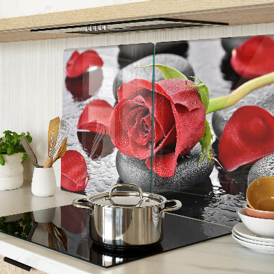 Glass cutting board Rose on stones with water drops