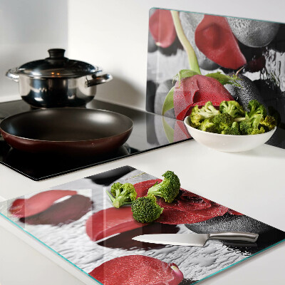 Glass cutting board Rose on stones with water drops