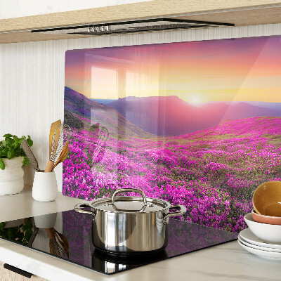 Glass kitchen board Floral landscape at sunset