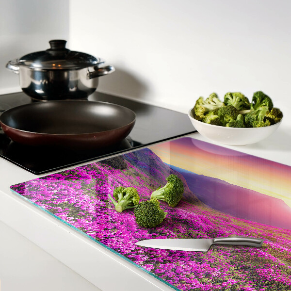 Glass kitchen board Floral landscape at sunset