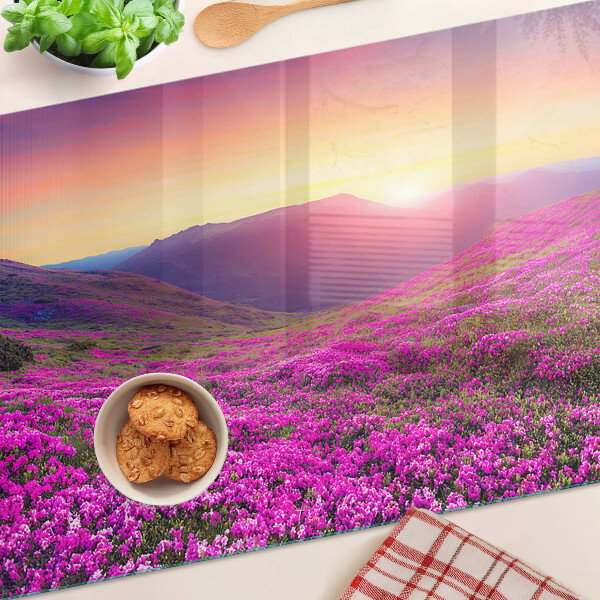 Glass kitchen board Floral landscape at sunset