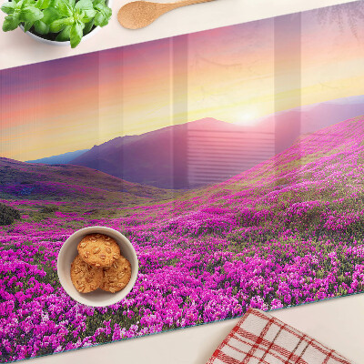 Glass kitchen board Floral landscape at sunset