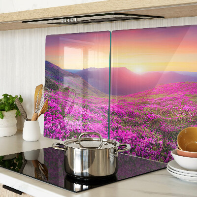 Glass kitchen board Floral landscape at sunset