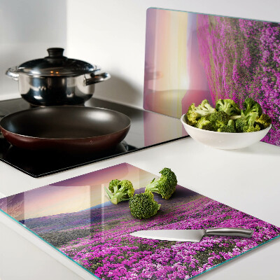 Glass kitchen board Floral landscape at sunset