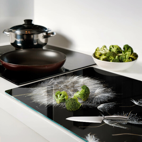 Glass chopping board Dandelions on a black background