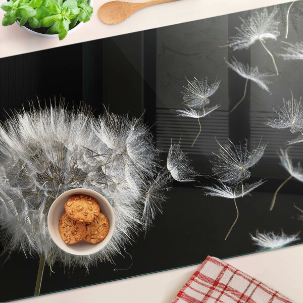 Glass chopping board Dandelions on a black background