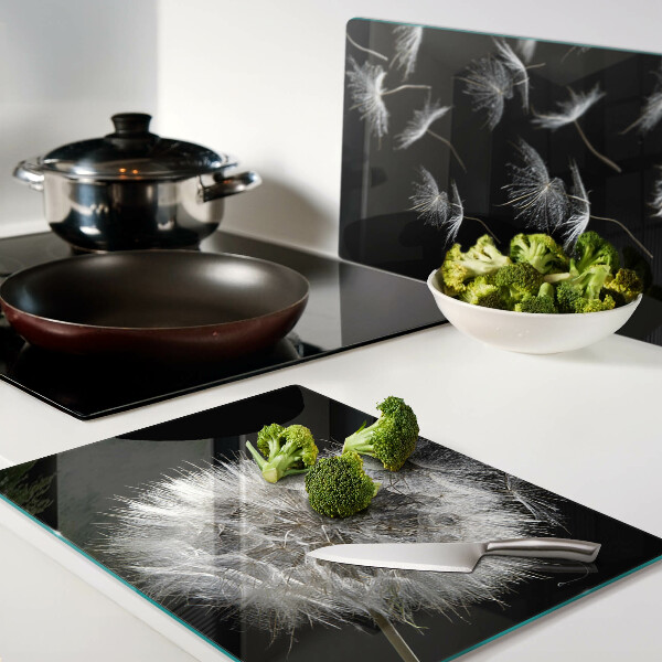 Glass chopping board Dandelions on a black background