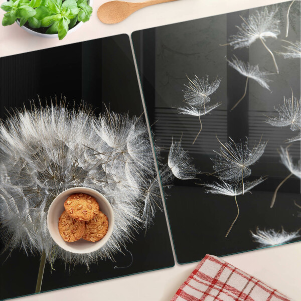 Glass chopping board Dandelions on a black background