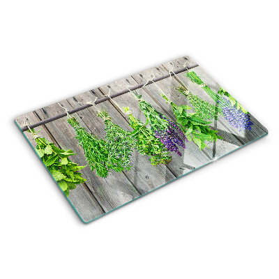 Cutting board Dried herbs on a wooden background