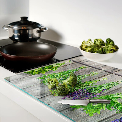 Cutting board Dried herbs on a wooden background