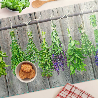 Cutting board Dried herbs on a wooden background