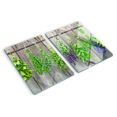 Cutting board Dried herbs on a wooden background