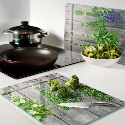 Cutting board Dried herbs on a wooden background