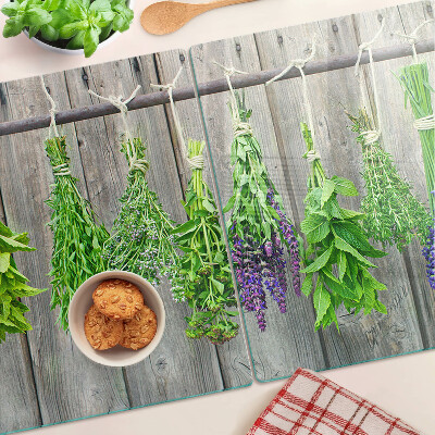 Cutting board Dried herbs on a wooden background