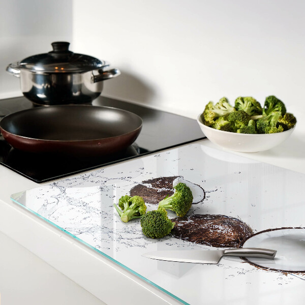 Glass kitchen board Coconuts in water