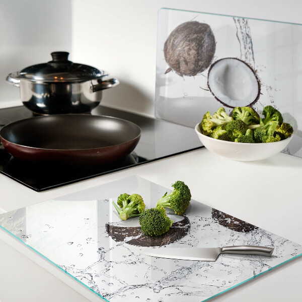 Glass kitchen board Coconuts in water